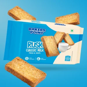 Baker's Point Classic Milk rusk pack among floating rusk slices
